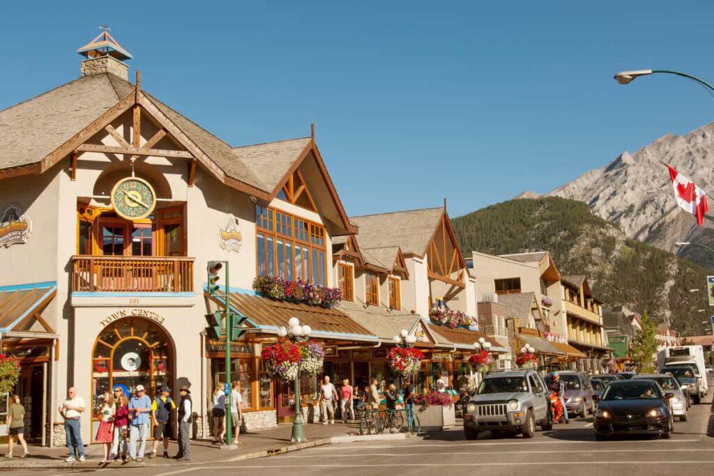 Bustling Banff Avenue on a clear day in the middle of summer