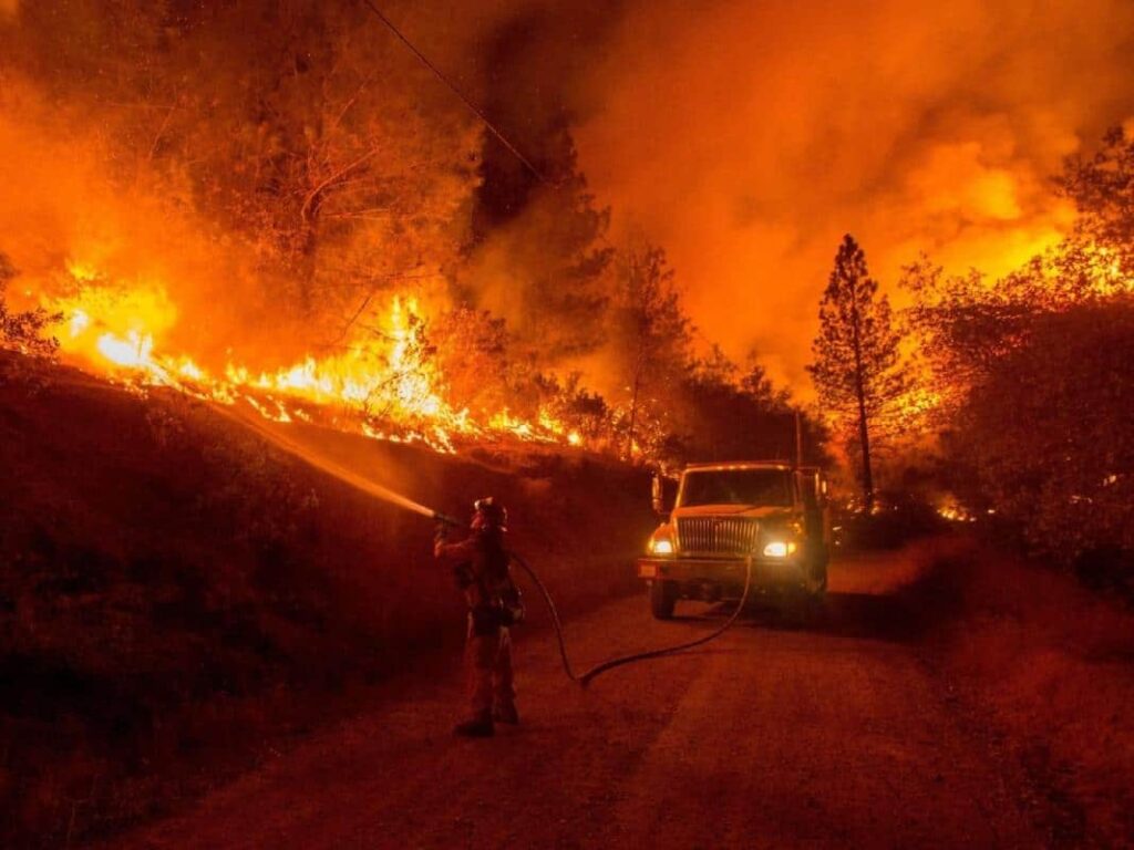 Firefighters try to control a blaze in the Rockies