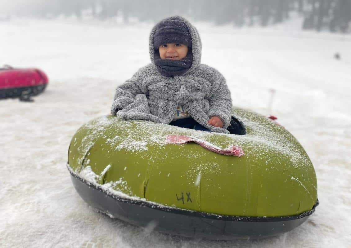 Kid on a tube during tubing in Banff.