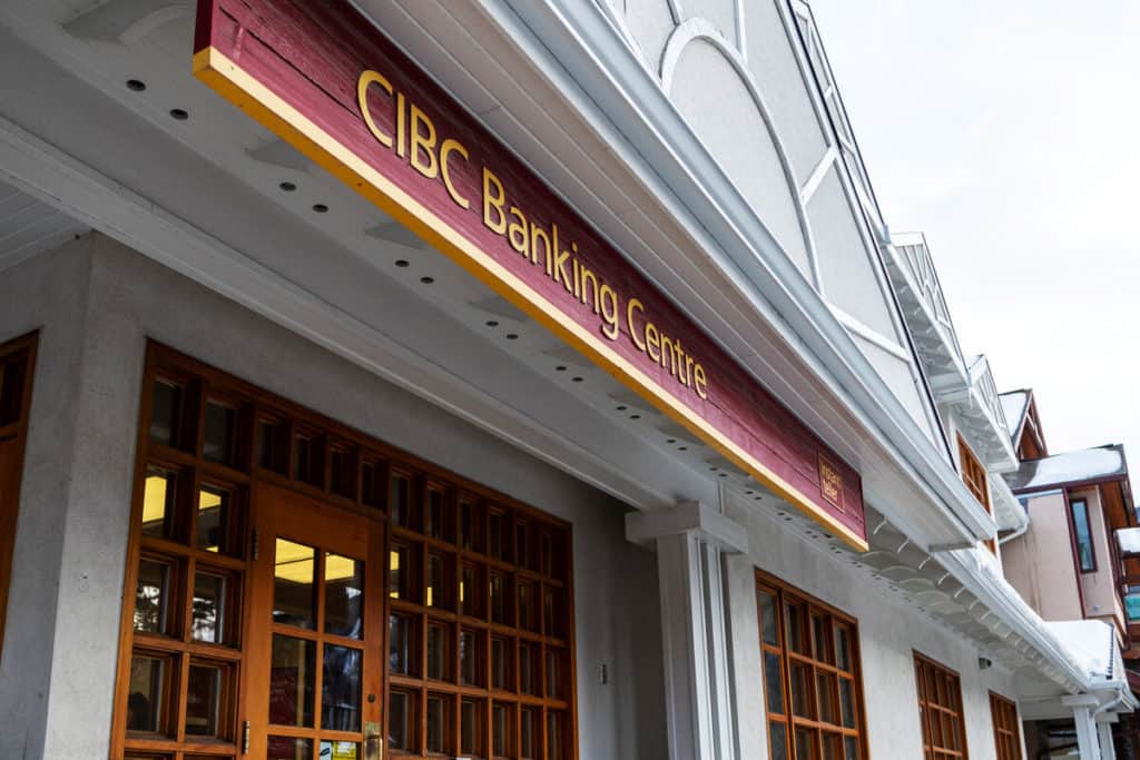 The CIBC bank with its sign on busy Banff Avenue