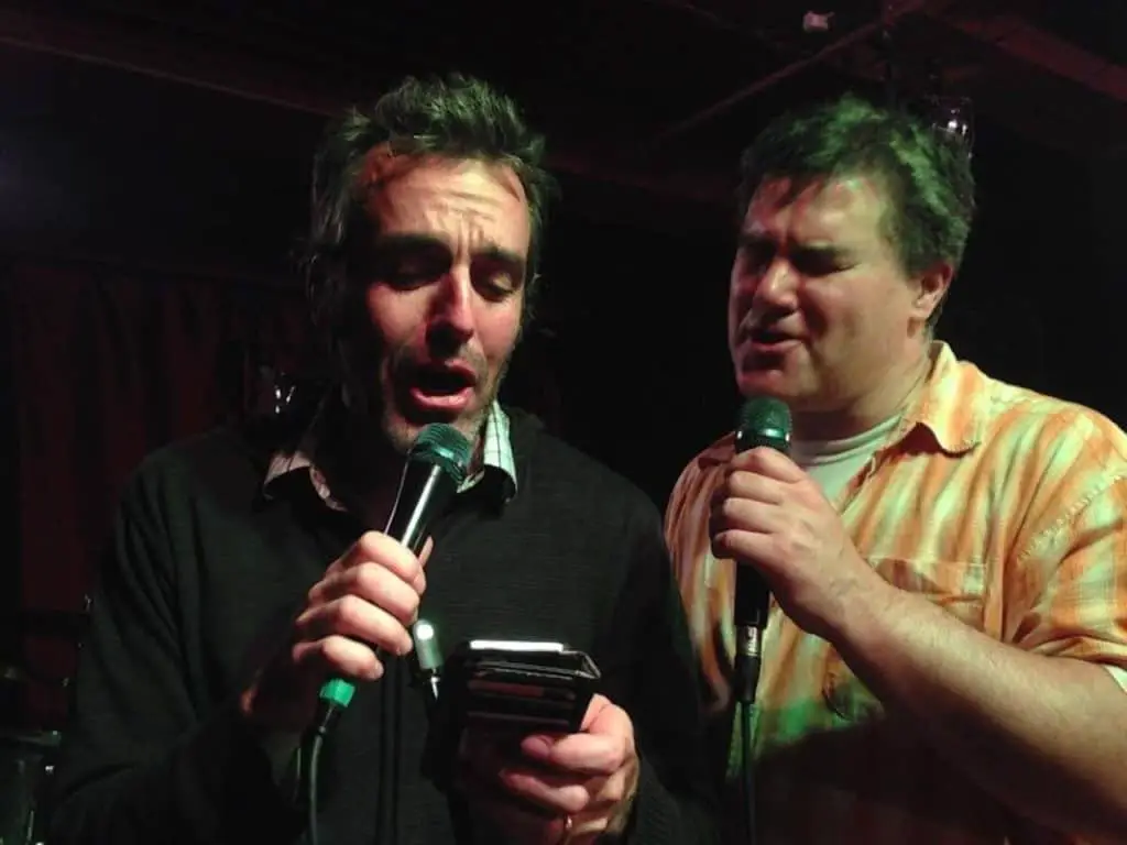 Two men singing karaoke in Banff