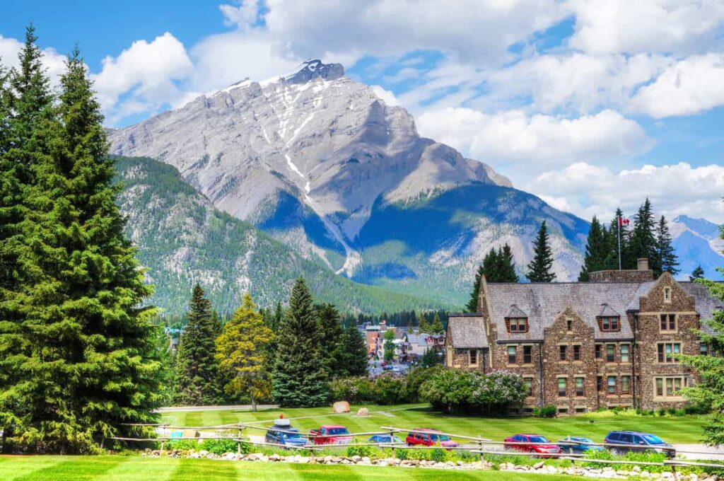 Cascade Mountain as seen from Cascade of Time Gardens in Banff with the Parks Canada administration building in the foreground.