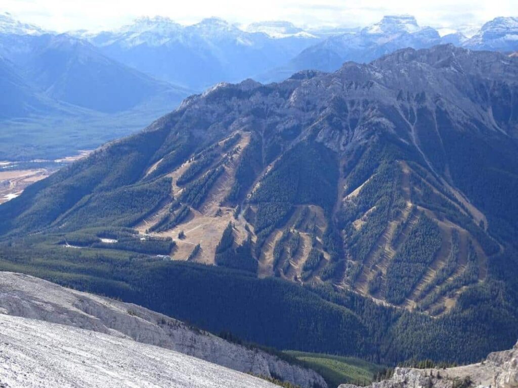 A view on the ski slopes of Norquay Mountain from its neighbor Cascade Mountain