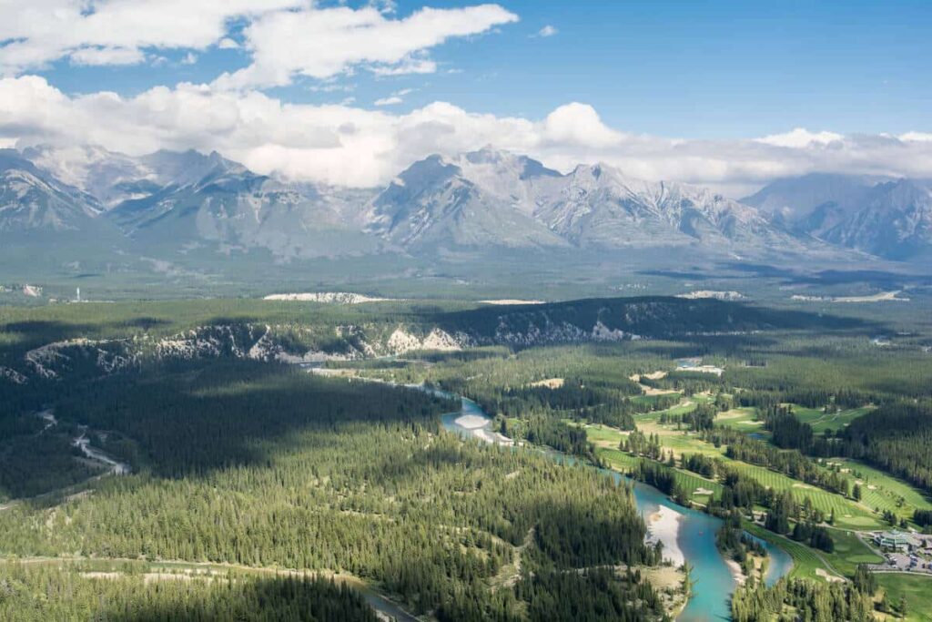 Aerial view of the Banff Springs Golf Course with the Canadian Rockies in the background