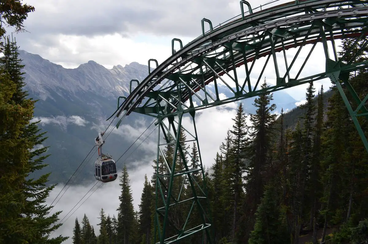 The Banff Gondola rises above the mist in the Rocky Mountains on its way to the top of Sulphur Mountain