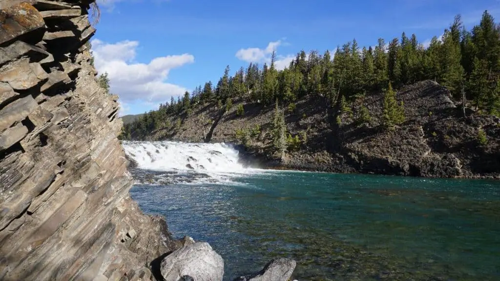 The Bow Falls seen from the shore of the Bow River in Banff National Park
