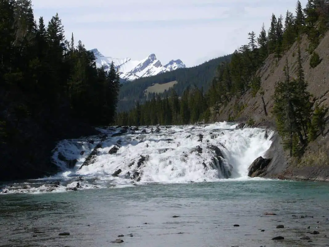 The Bow Falls near Banff with in the background the Rocky Mountains