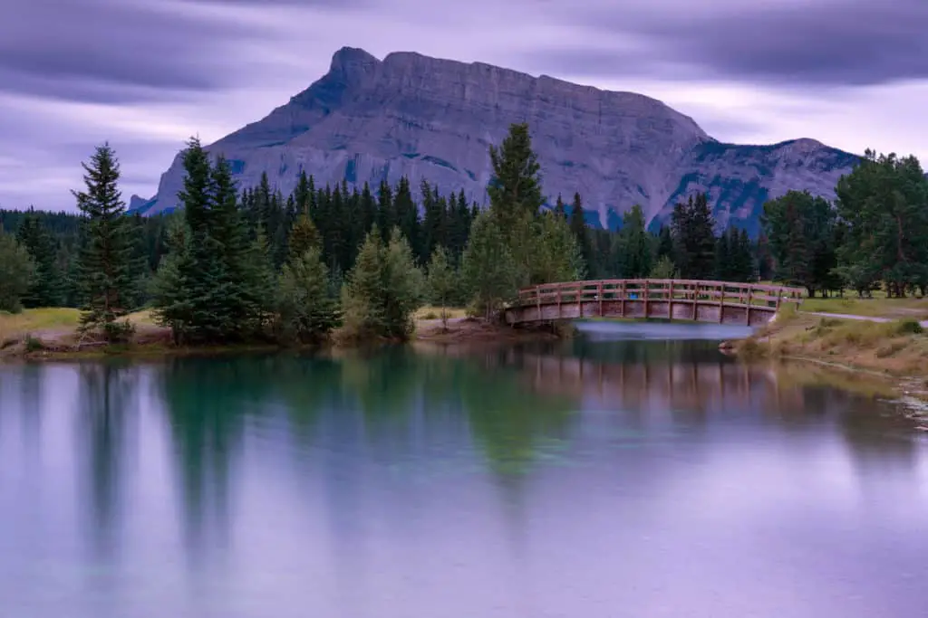 A bridge crosses Cascade Ponds in Banff National Park