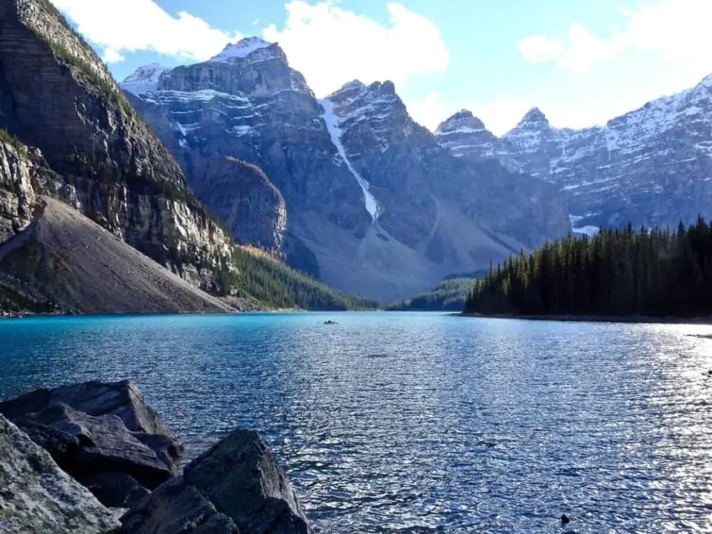 A canoe on Moraine Lake, seen from the rock pile at the lake shore