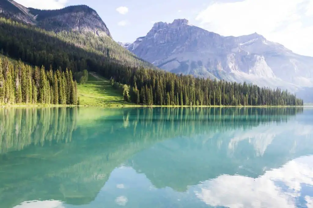The turquoise water of Emerald Lake in Yoho National Park reflects the surrounding mountains