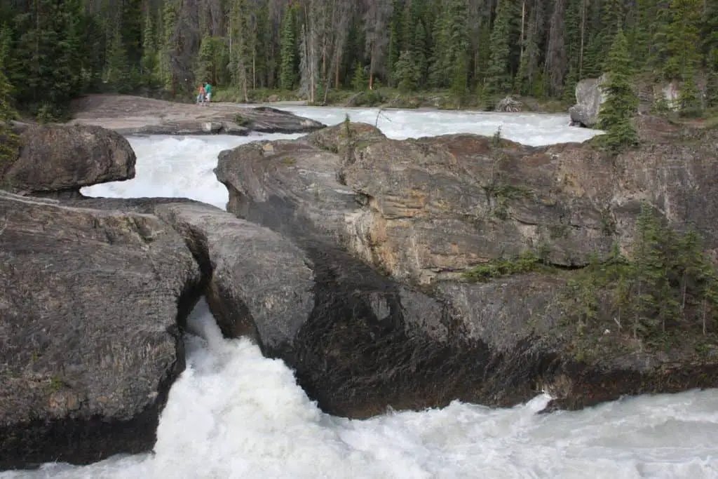 The natural bridge in Yoho National Park with the Kicking Horse river rushing underneath