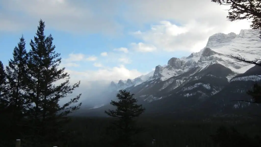 The Rocky Mountains near the town of Canmore, Alberta, disappearing in the fog
