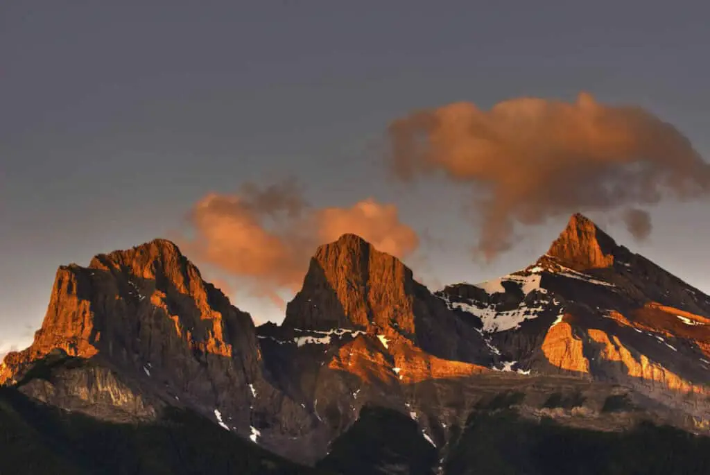 The Three Sisters near the town of Canmore, Alberta during sunset