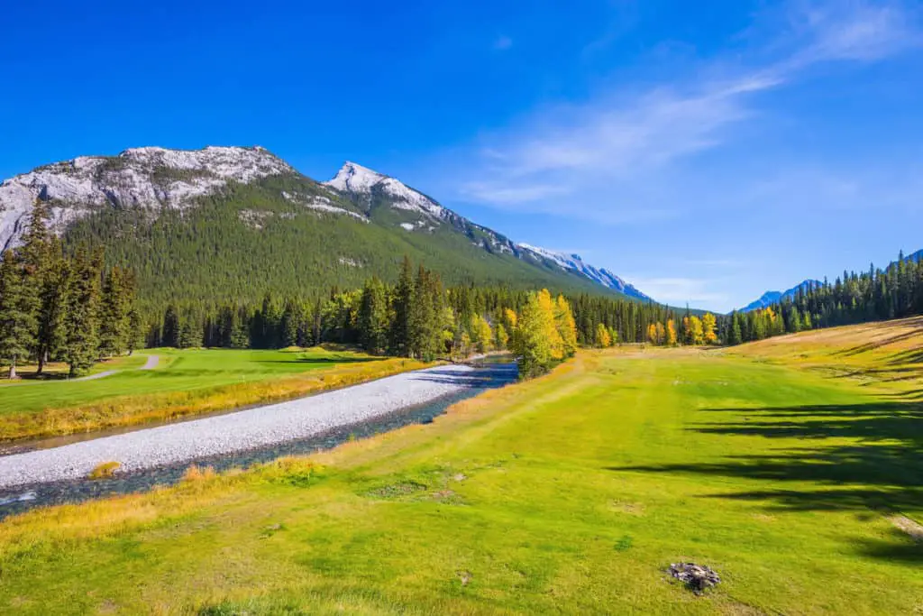 The greens of the Banff Springs Golf Course with Mount Rundle in the background
