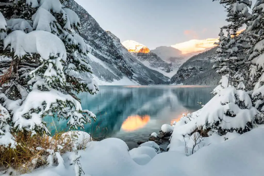 Lake Louise at sunrise. The lake is snowed in during early winter when the lake is not yet frozen