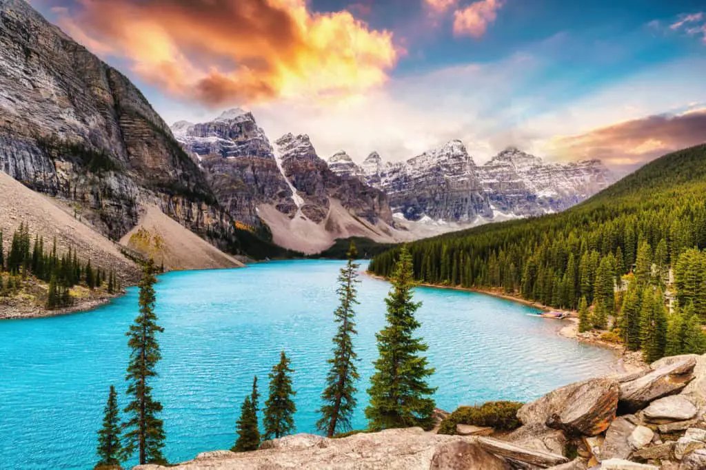 Moraine Lake under a colorful and cloudy sky during sunrise