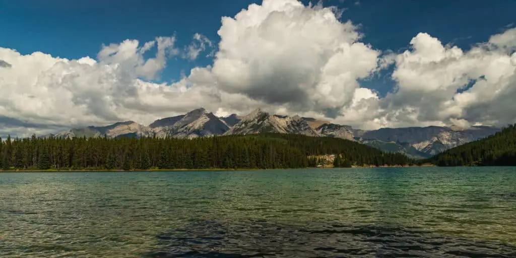 Clouds hover over Two Jack Lake and the surrounding mountains in Banff National Park