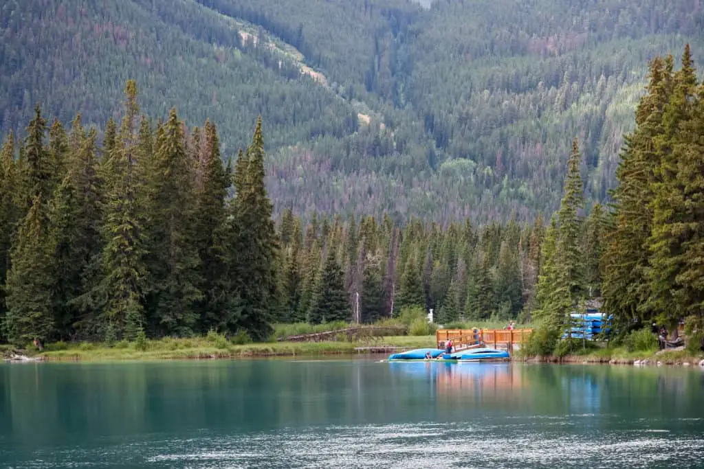 Canoes lie on a jetty on the Bow River near the town of Banff