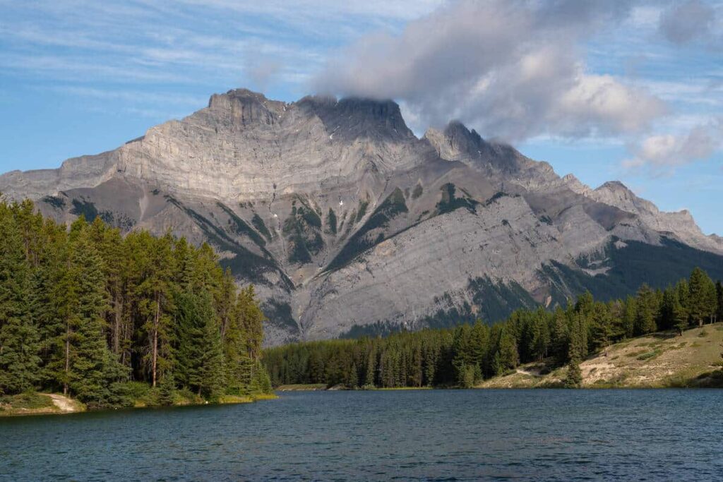 Cascade Mountain towering high above the calm waters of Johnson Lake in Banff National Park