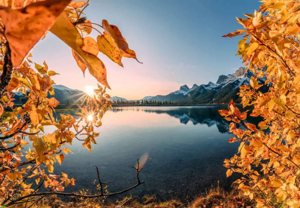 Fall colors surround the Rundle Forebay Reservoir in the Canadian Rocky Mountains, near Canmore, Alberta 