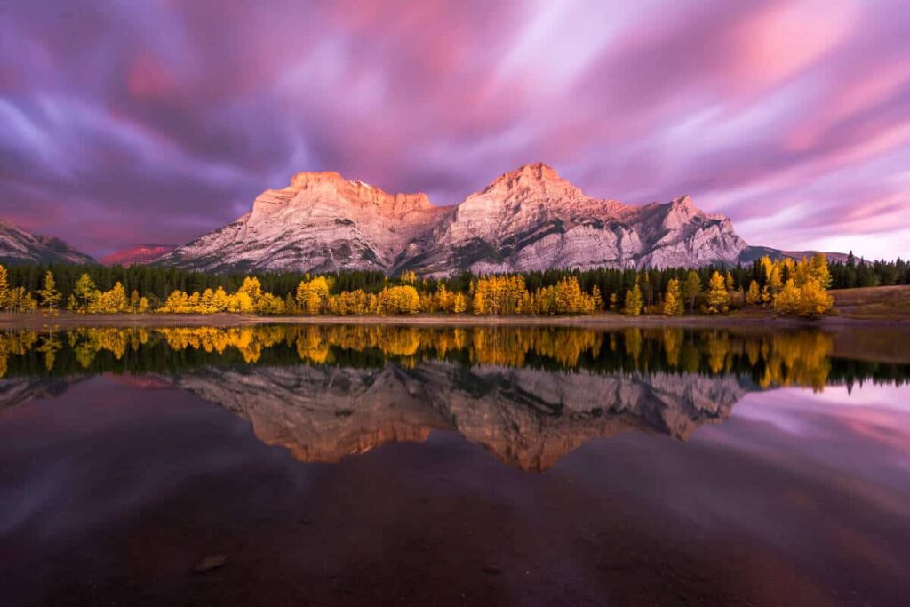 Wedge Pond in Kananaskis Country under a gorgeous pink sky during sunset