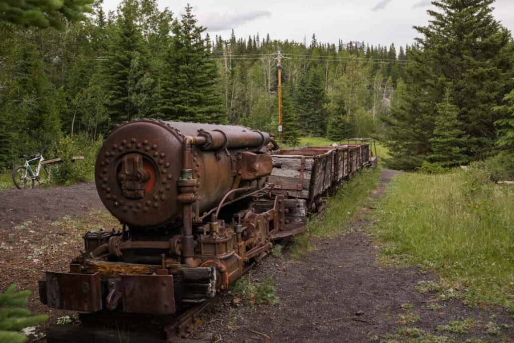 An old locomotive of an abandoned coal train in the ghost town of Bankhead in Banff National Park