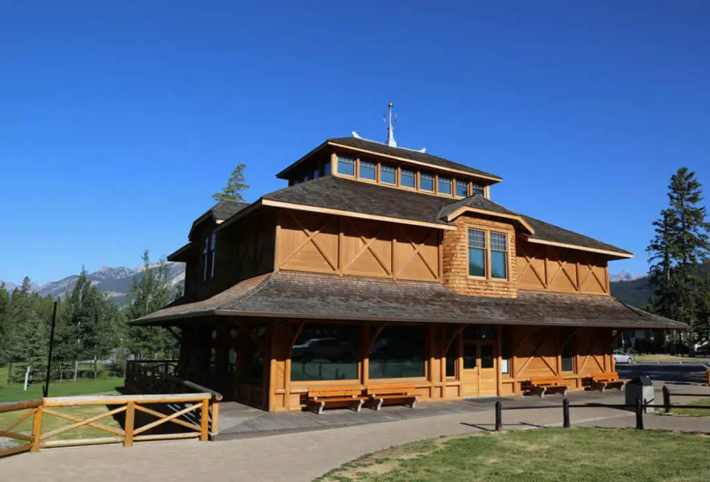 The wooden exterior of the Banff Park Museum near the town of Banff under a perfect blue sky