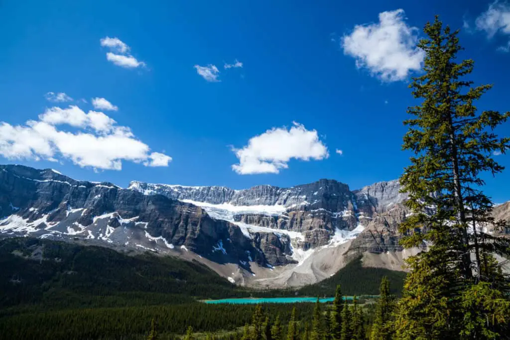 The Crowfoot Glacier seen from afar, with the turquoise blue color of Bow Lake in the valley