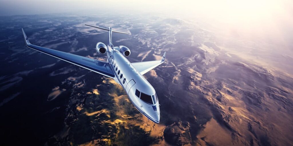 A private jet flying above the Canadian Rocky Mountains