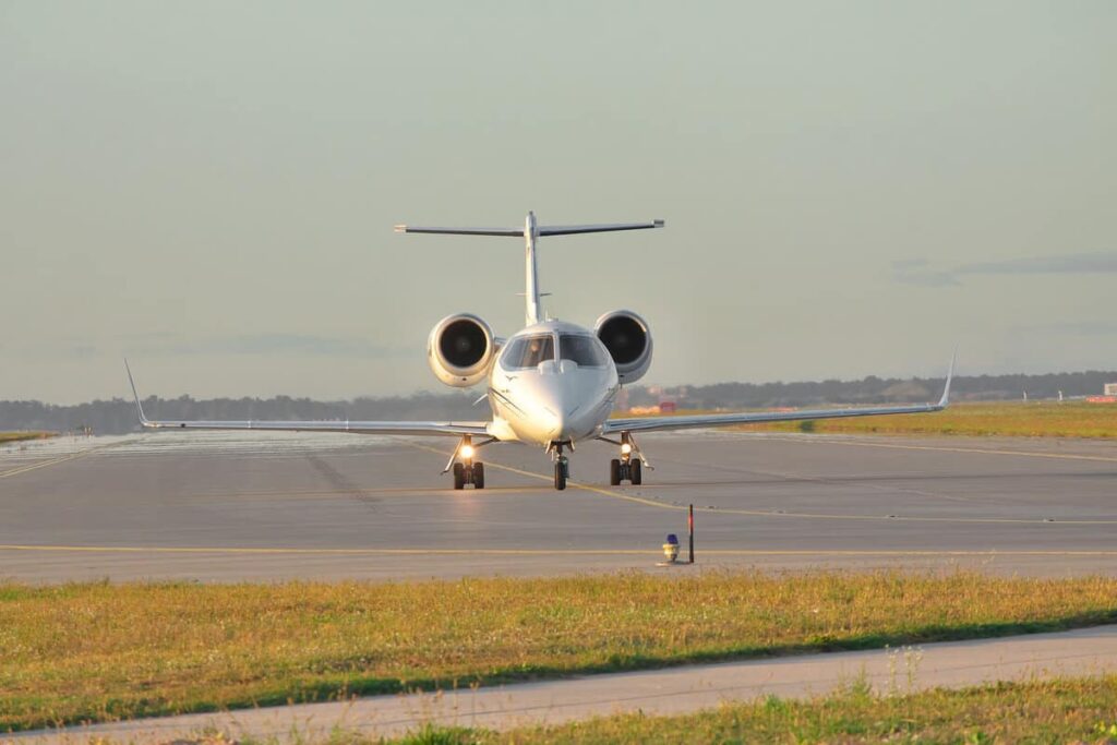 A private jet speeding for take off on an airport strip